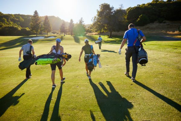 Golf app golfers walking towards green